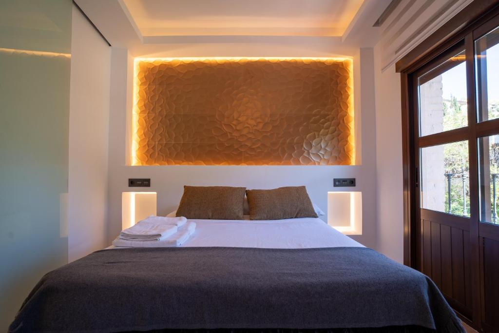 Postel nebo postele na pokoji v ubytování Apartamento para dos a los pies de la Alhambra
