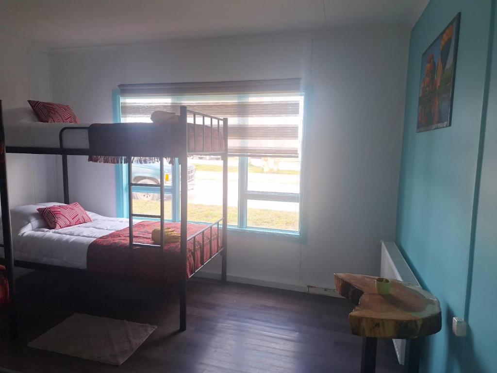 Postel nebo postele na pokoji v ubytování Hostel Kuntur
