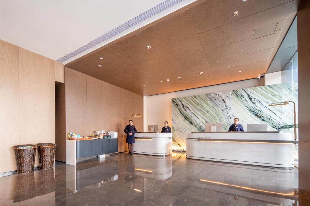 Vstupní hala nebo recepce v ubytování Mehood Lestie Hotel Pazhou Convention and Exhibition Center Branch - Free Shuttle Bus to Canton Fair Complex During Canton Fair Period