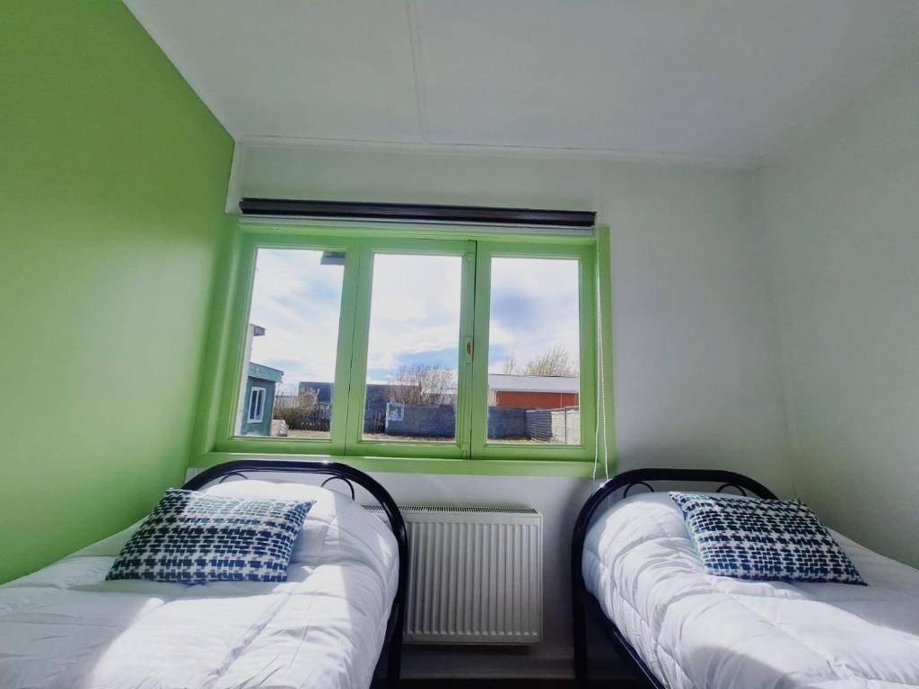 Postel nebo postele na pokoji v ubytování Hostel Kuntur