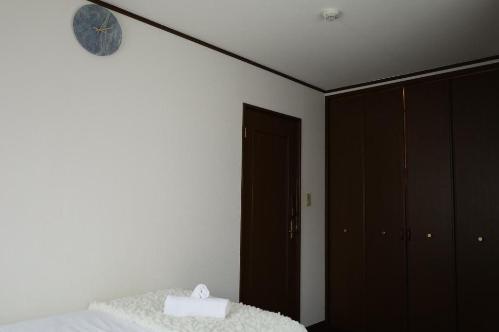 Postel nebo postele na pokoji v ubytování 西川口ハウス最大12名家族団体