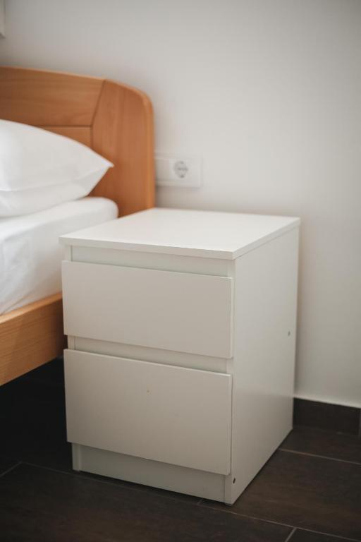 Postel nebo postele na pokoji v ubytování Apartmani Davidović