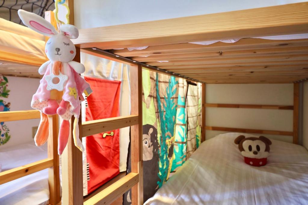 Postel nebo postele na pokoji v ubytování 西川口ハウス最大12名家族団体