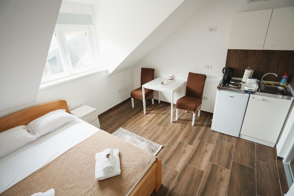 Kuchyň nebo kuchyňský kout v ubytování Apartmani Davidović