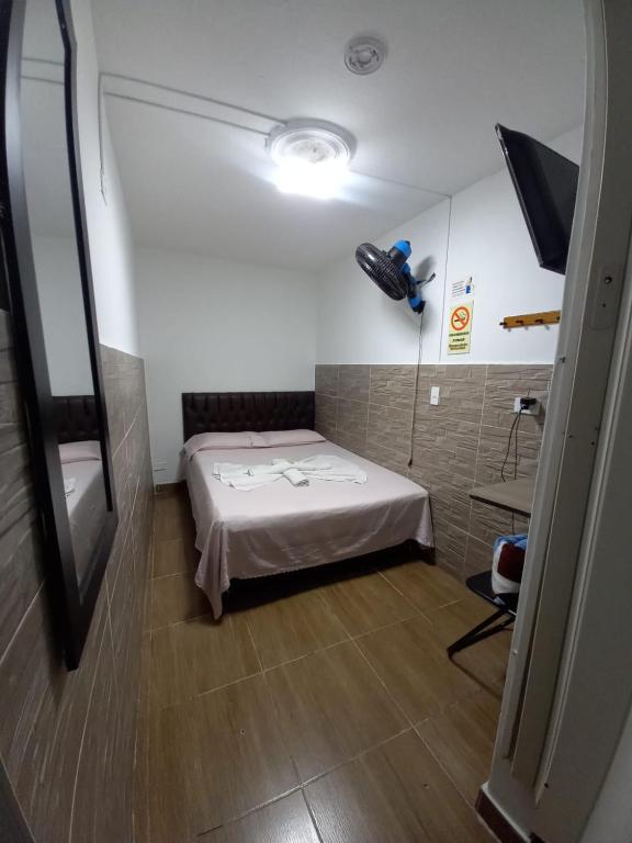 Postel nebo postele na pokoji v ubytování Hospedaje Ricaribe