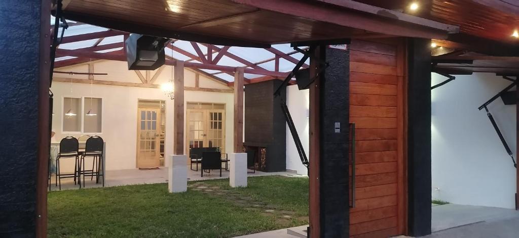 a pergola in the backyard of a house at RANCH HAUS OXAPAMPA - PeT FRIENDLY in Oxapampa
