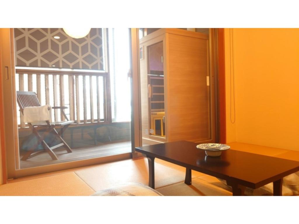 a living room with a coffee table and a balcony at Tokigasane - Vacation STAY 21013v in Kaga