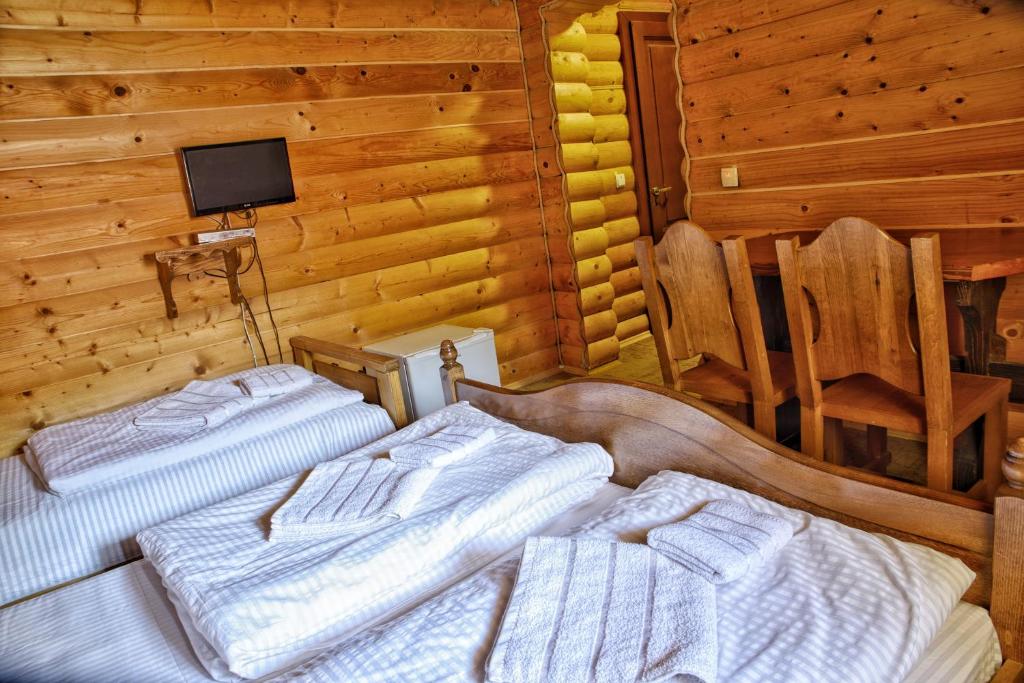 Postel nebo postele na pokoji v ubytování Gotel Milenium