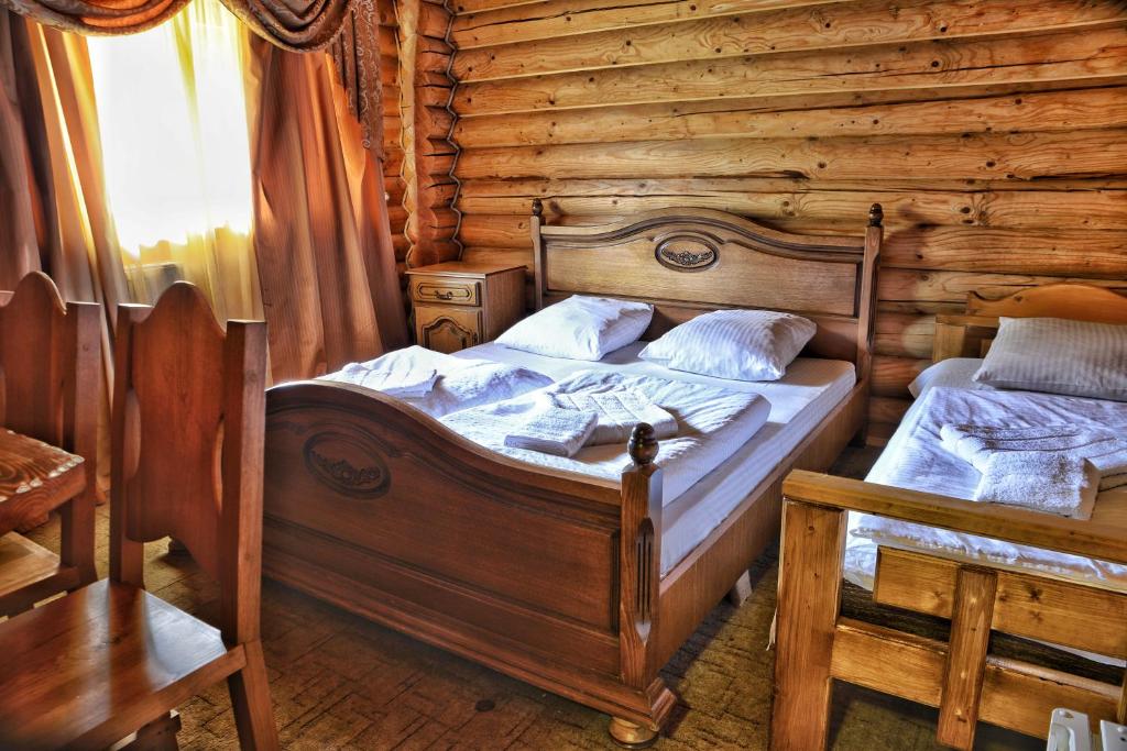Postel nebo postele na pokoji v ubytování Gotel Milenium