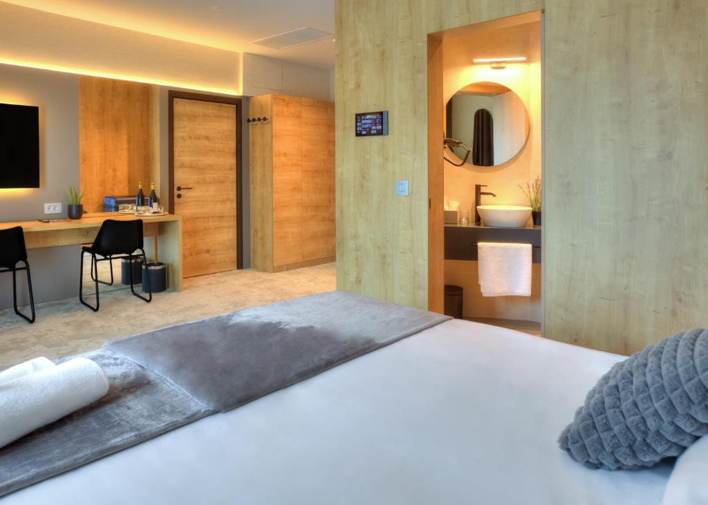Postel nebo postele na pokoji v ubytování Hotel Experience