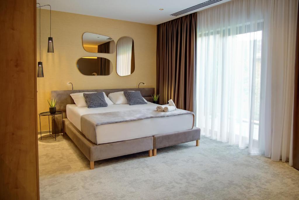 Postel nebo postele na pokoji v ubytování Hotel Experience