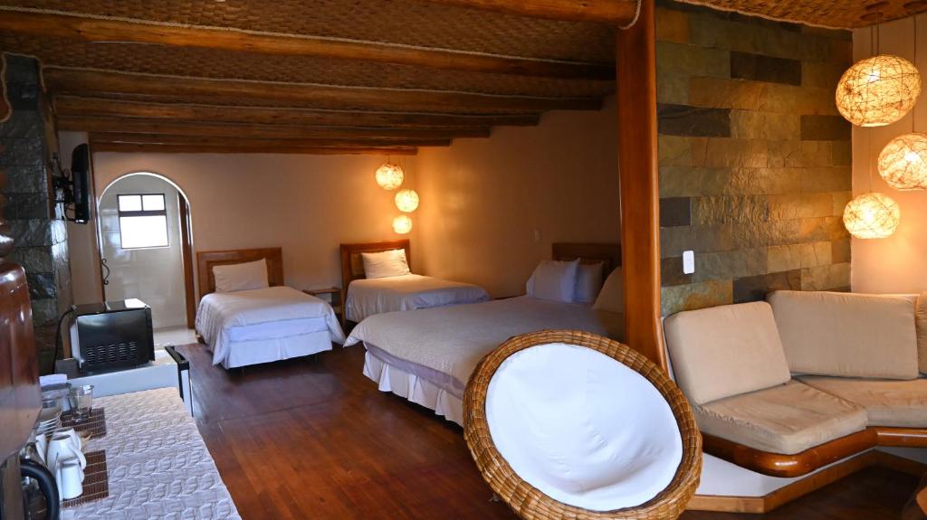 Postel nebo postele na pokoji v ubytování Hosteria Cabañas Del Lago