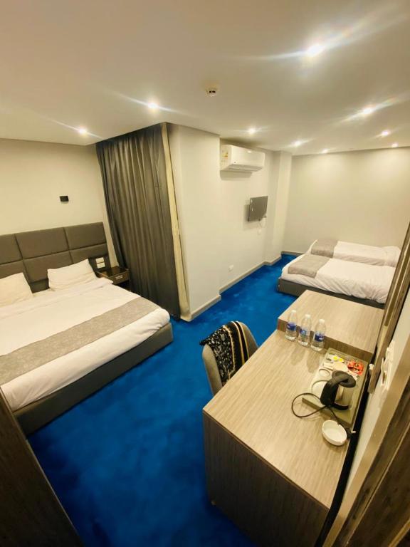 Postel nebo postele na pokoji v ubytování nuba nile hotel