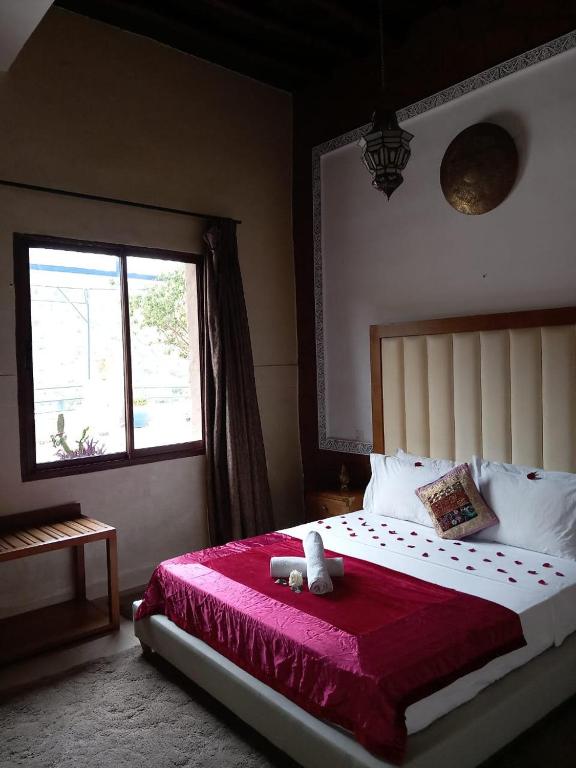 Postel nebo postele na pokoji v ubytování Auberge kasbah tifirte