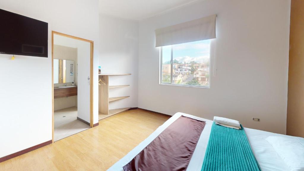 Postel nebo postele na pokoji v ubytování Hotel Villa Colonia