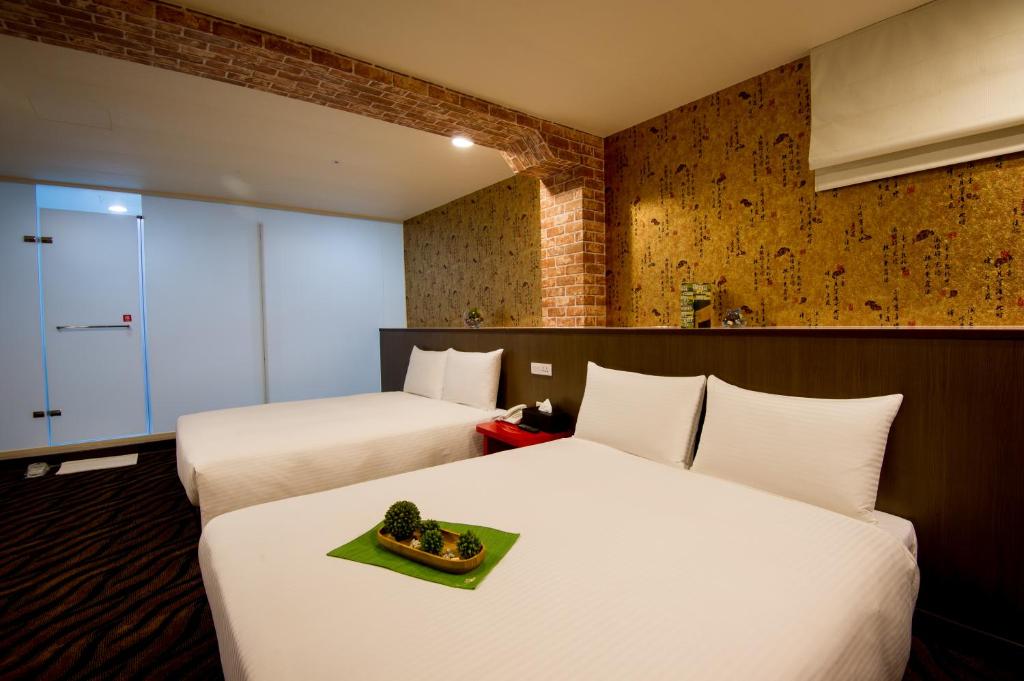 Postel nebo postele na pokoji v ubytování Hotel 6 - ZhongHua