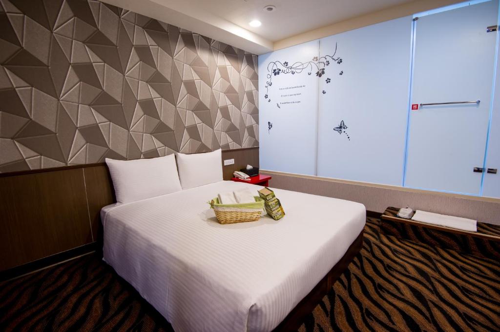 Postel nebo postele na pokoji v ubytování Hotel 6 - ZhongHua