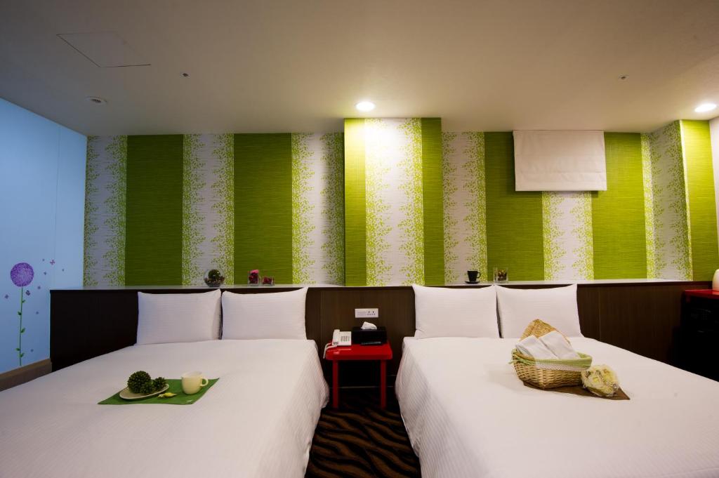 Postel nebo postele na pokoji v ubytování Hotel 6 - ZhongHua