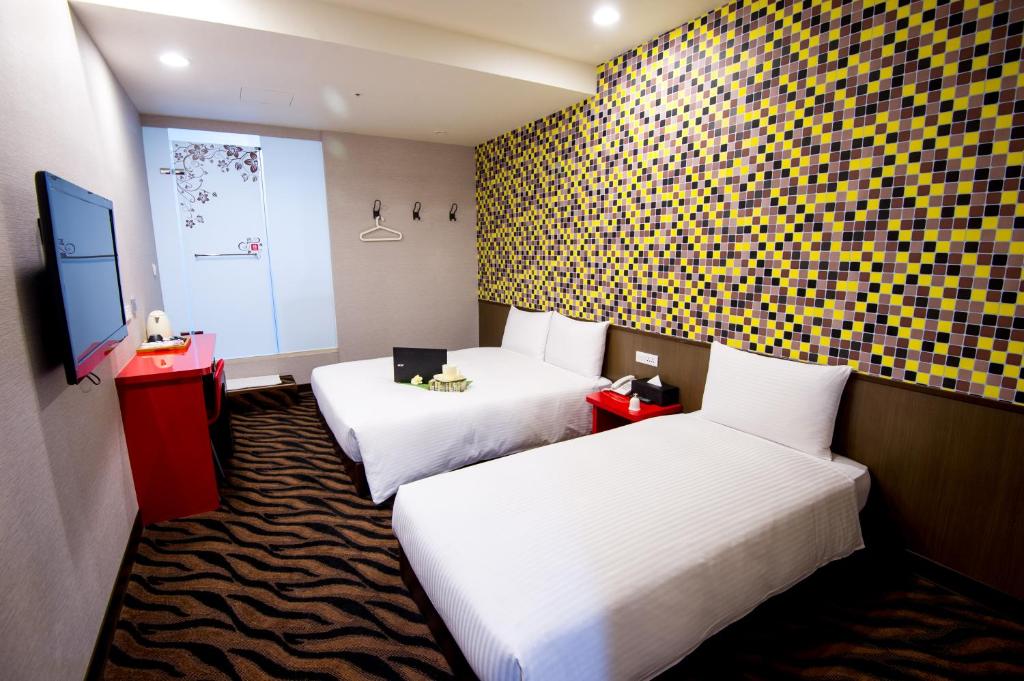 Postel nebo postele na pokoji v ubytování Hotel 6 - ZhongHua