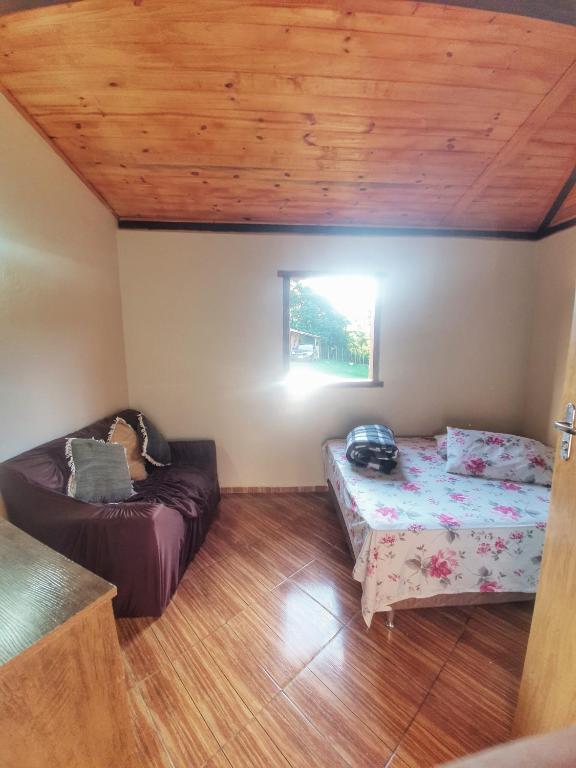 Postel nebo postele na pokoji v ubytování Chalé e Camping Elementais