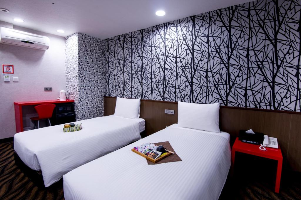 Postel nebo postele na pokoji v ubytování Hotel 6 - ZhongHua