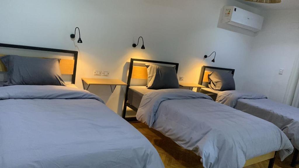 Postel nebo postele na pokoji v ubytování Pyramids Nights Hostel