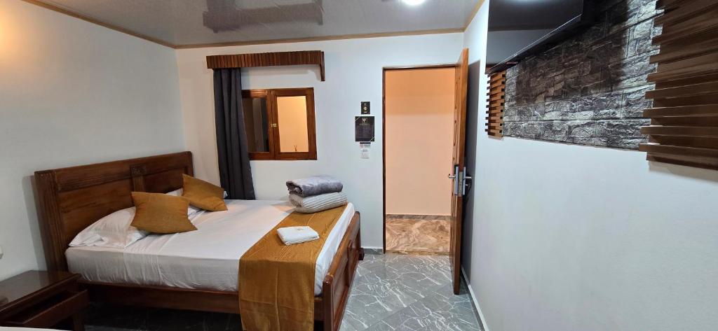 Postel nebo postele na pokoji v ubytování HOTEL EL VALENCIA
