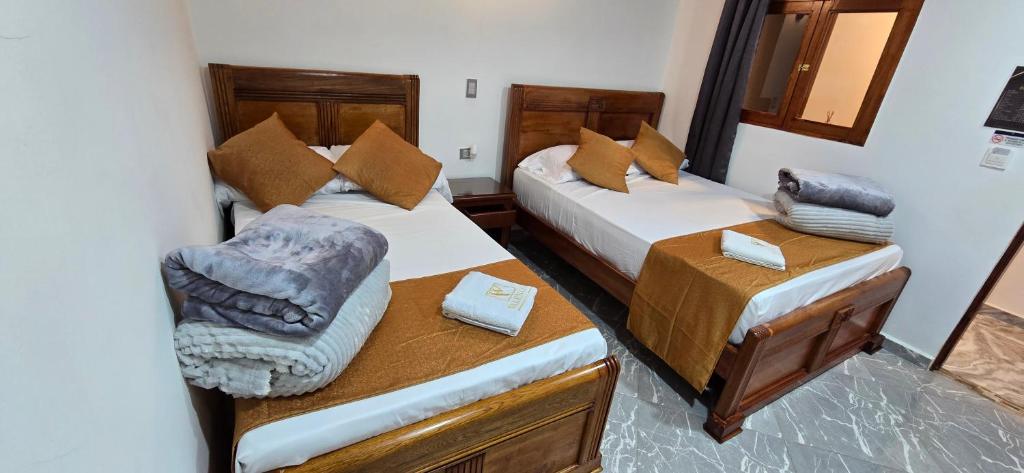 Postel nebo postele na pokoji v ubytování HOTEL EL VALENCIA