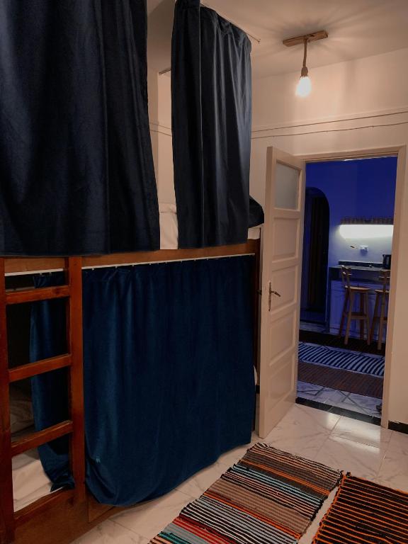 Postel nebo postele na pokoji v ubytování MRHostel Luxor