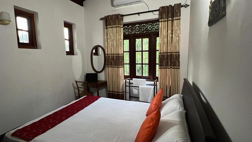 Ένα ή περισσότερα κρεβάτια σε δωμάτιο στο Tanya Homestay