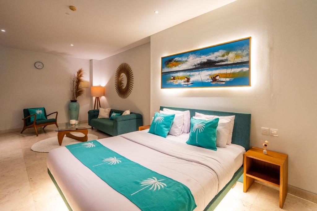 Postel nebo postele na pokoji v ubytování AQ-VA Hotel & Villas Seminyak