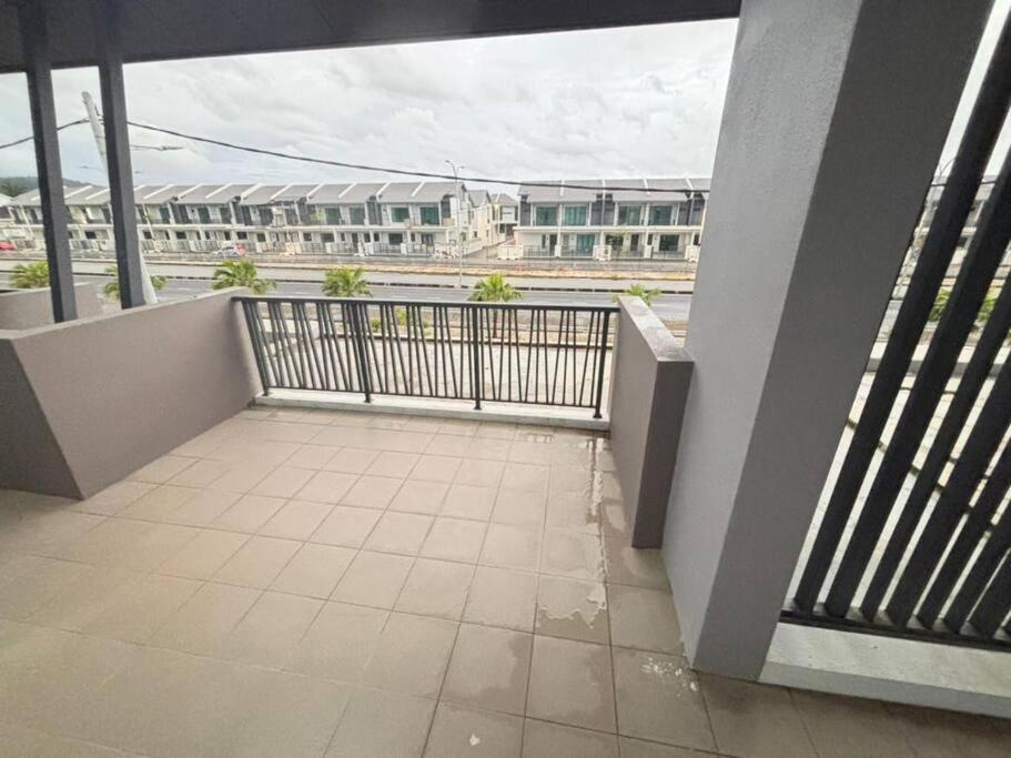 a balcony with a view of a building at Hz homestay in Simpang Ampat