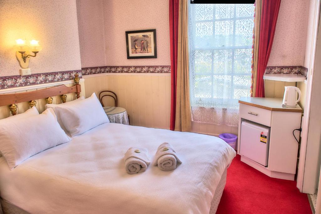 Postel nebo postele na pokoji v ubytování Hillview House Launceston