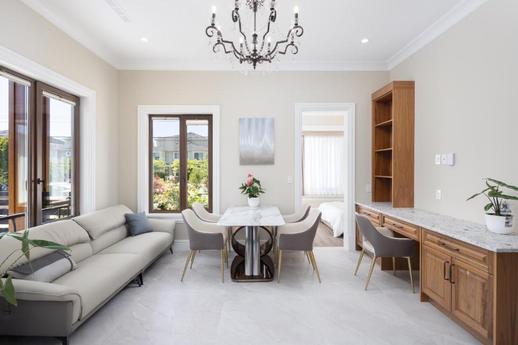 a living room with a couch and a table at Vancouver Vacation Home in Richmond