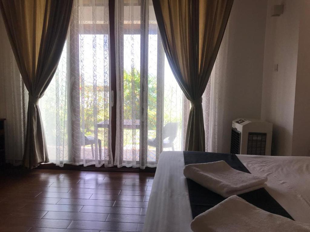 Postel nebo postele na pokoji v ubytování Capital Wind Beach Cabanas