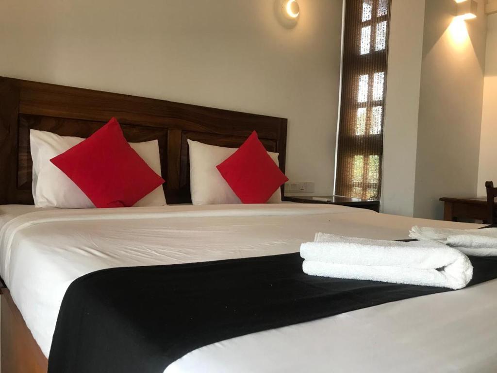 Postel nebo postele na pokoji v ubytování Capital Wind Beach Cabanas