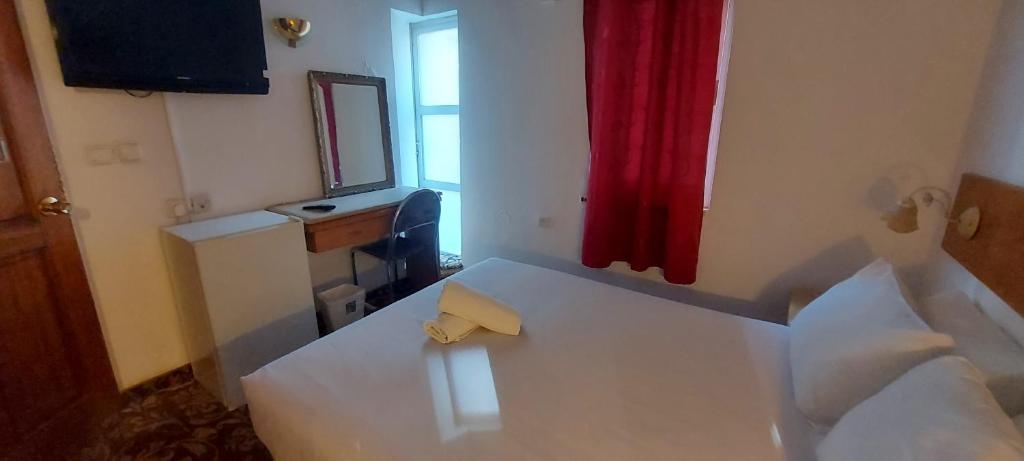 Postel nebo postele na pokoji v ubytování Zion Hotel
