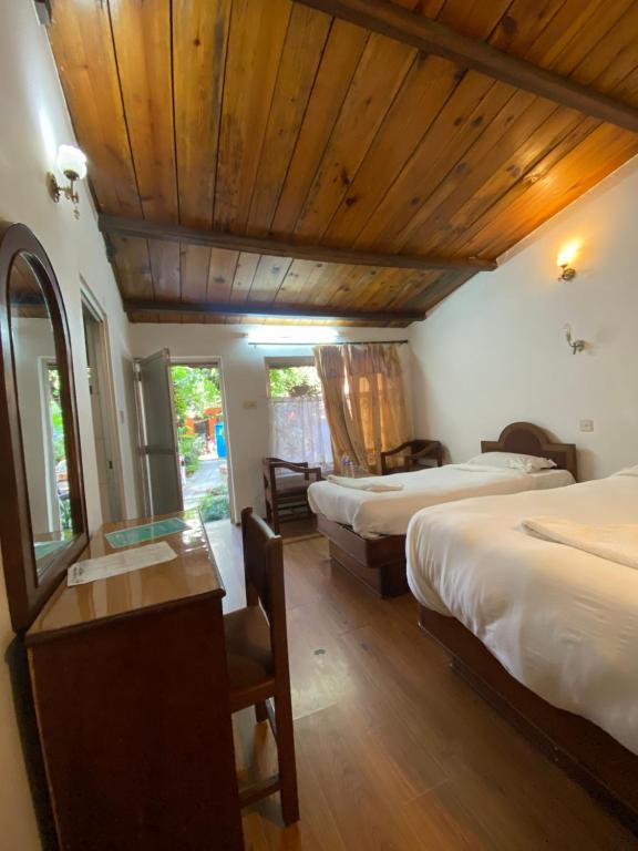 Postel nebo postele na pokoji v ubytování Sun Rise Cottage