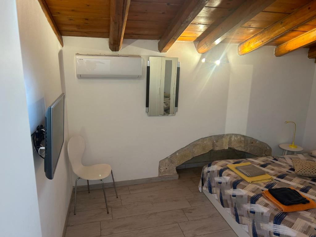 Televízia a/alebo spoločenská miestnosť v ubytovaní Deni's Apartments