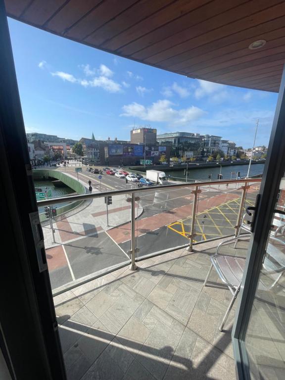 a view of a city from a window at Fabulous and Sunny 2 bed Apartment, in City Centre in Cork