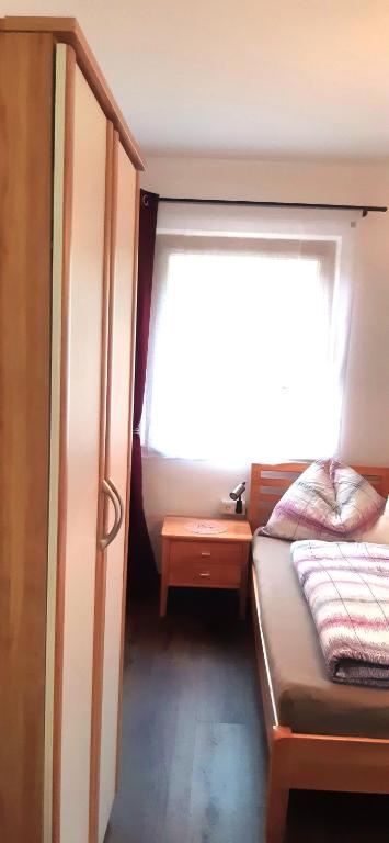 Postel nebo postele na pokoji v ubytování Gästehaus Steinerhof