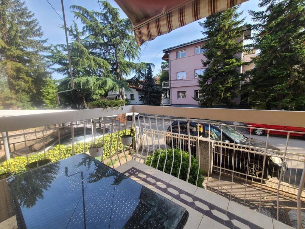 a balcony with a view of a building at Ace in Vodno