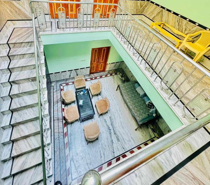 an overhead view of a room with chairs and tables at Rose Merry Guesthouse in Bikaner
