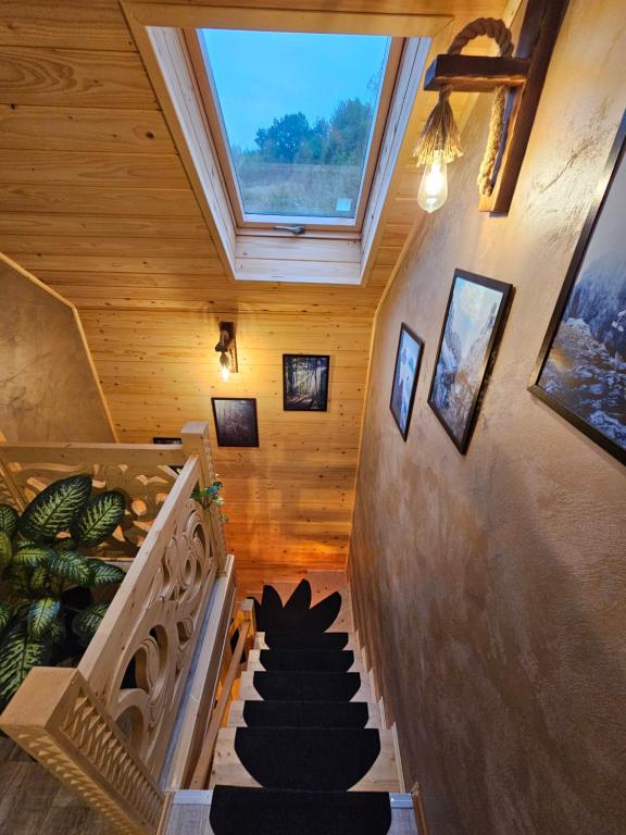 a staircase in a house with a skylight at Leśne Zacisze & Spa na wyłączność in Lubień