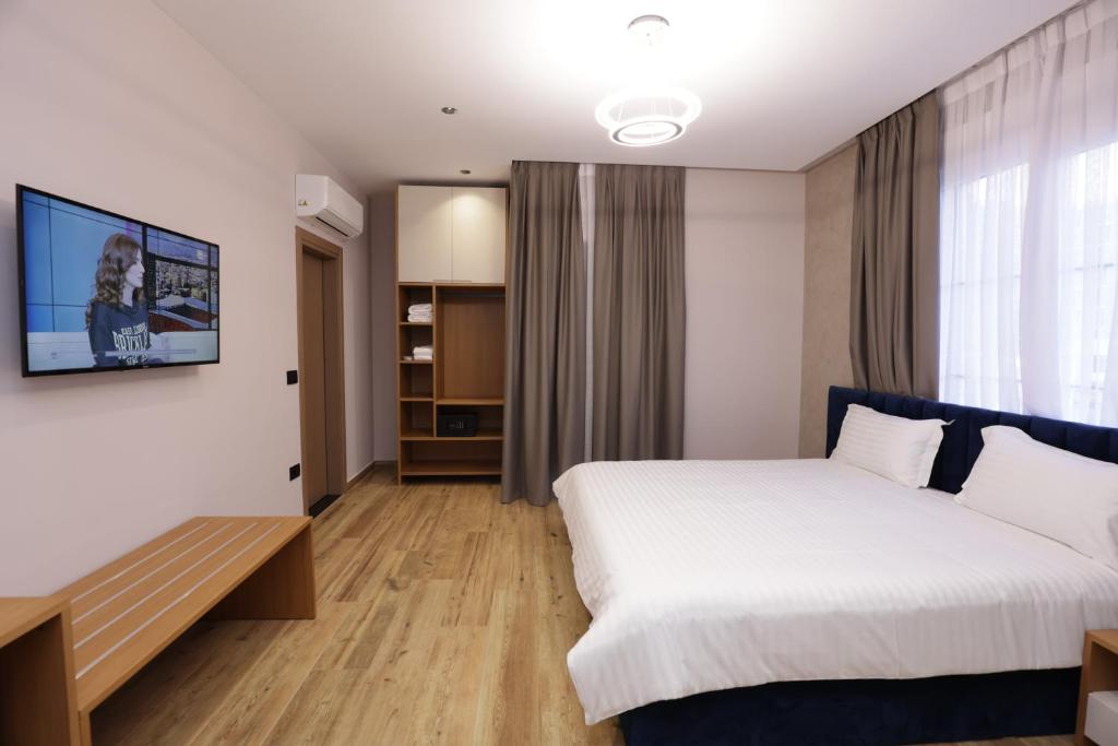 Postel nebo postele na pokoji v ubytování Residence Inn Tirana