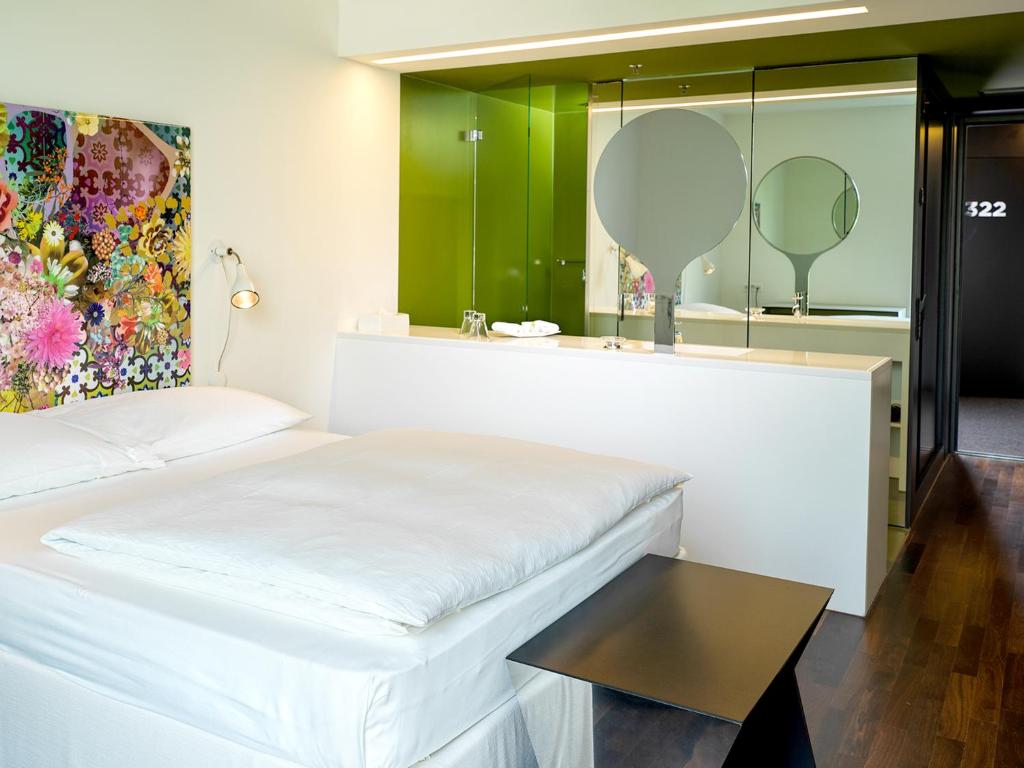 Postel nebo postele na pokoji v ubytování City Garden Hotel