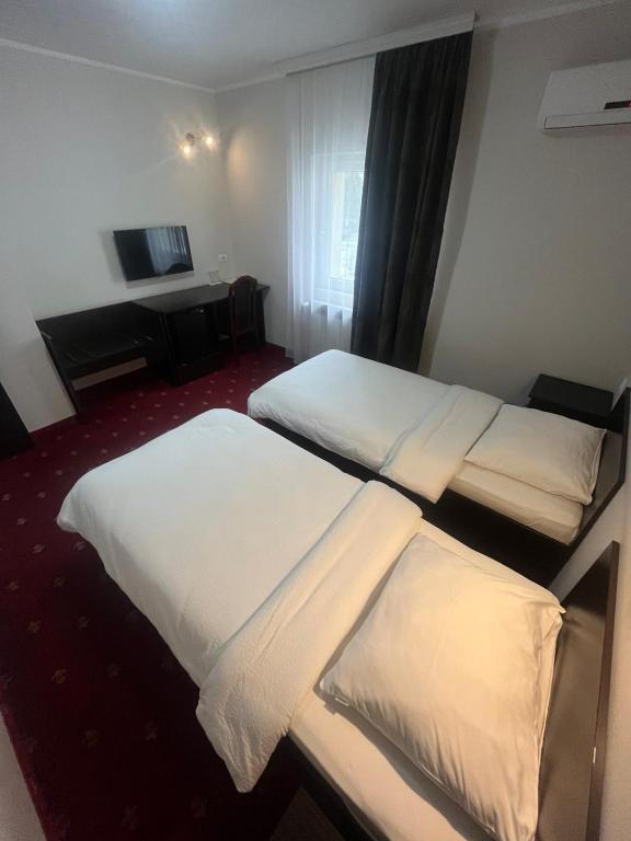 Postel nebo postele na pokoji v ubytování Hotel Elegance