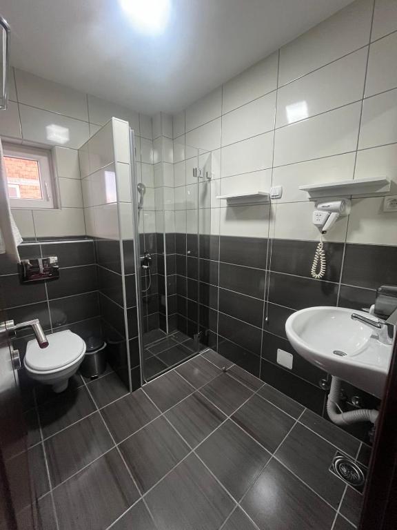 Koupelna v ubytování Hotel Elegance