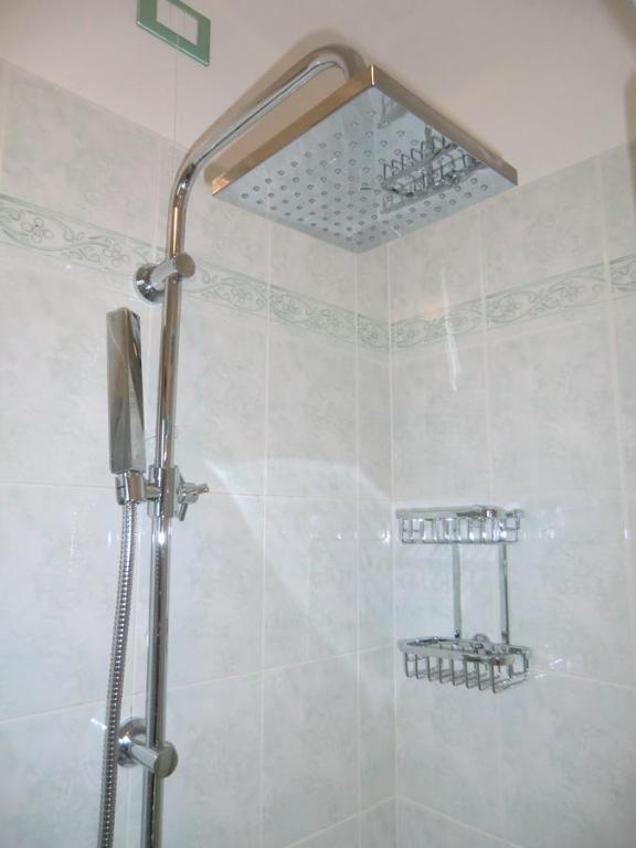 Ванная комната в Residence Villaggio dei Fiori con Piscina e Posto Spiaggia Incluso