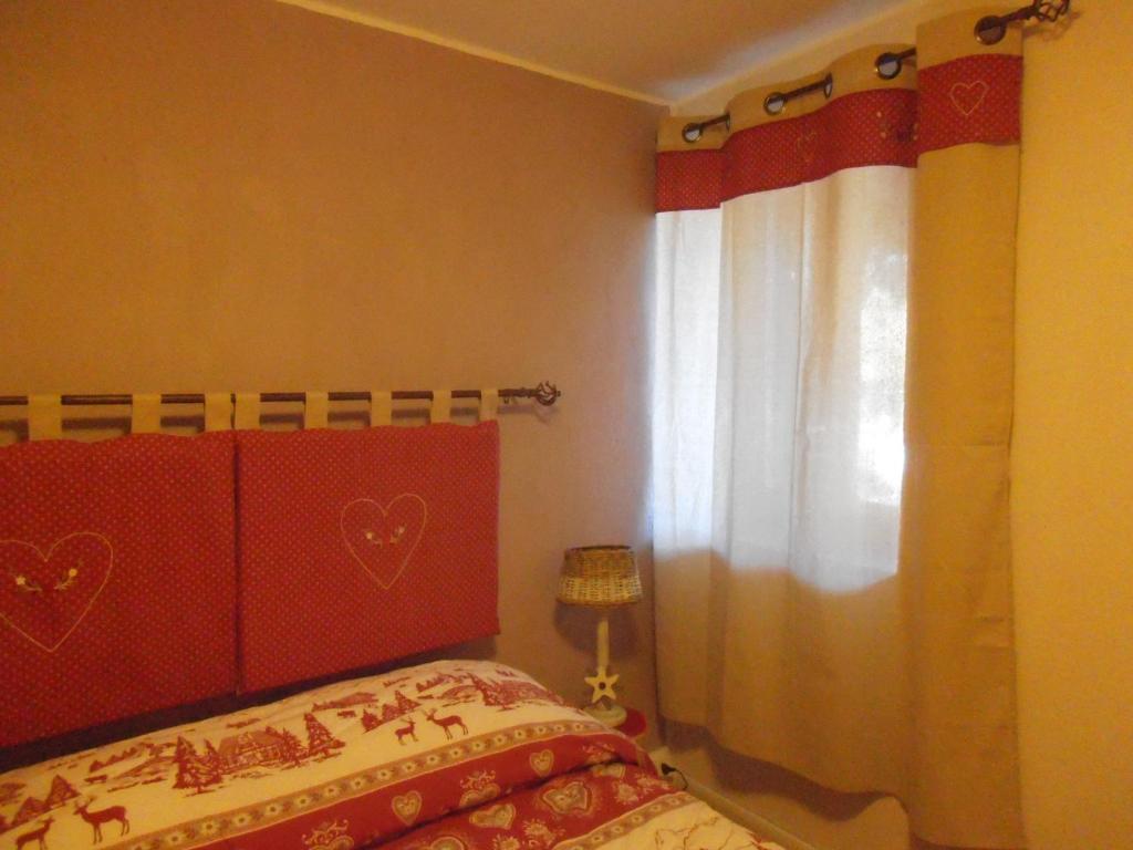 Posteľ alebo postele v izbe v ubytovaní La Casetta Del Dahu